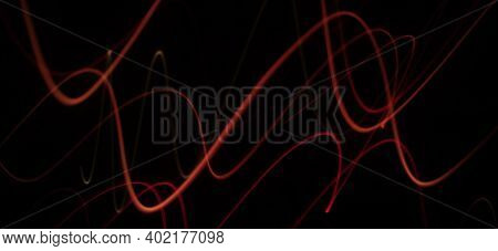 Neon Red Colored Curve Wave Pattern Abstract Made Using Light Painting Technique In A Isolated Black