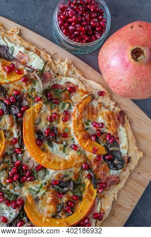 Tarte Flambee With Pumpkin, Cheese, Kale And Pomegranate
