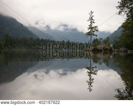 Fishing Boat On Alpine Mountain Lake Hintersee Cloudy Mood Reflection Ramsau Berchtesgadener Land Ba