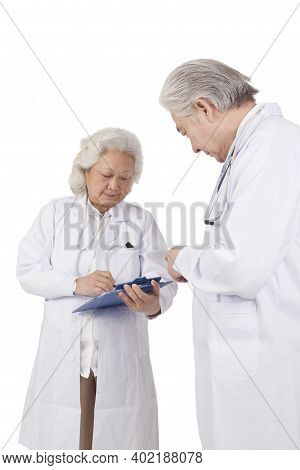 Standing Portraits Of Two Elderly Senior Doctors High Quality Photo