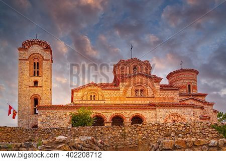 Ohrid, North Macedonia, St. Clement Church At Plaosnik Site With Flags And Sunset Sky