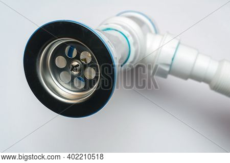 New Plastic Siphon For Sink Assembled On White Background. Siphon For Washbasin And Bathroom
