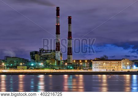 High Factory Chimneys On The Sinopskaya Embankment Of The Neva River. Russia, Saint Petersburg, Nigh