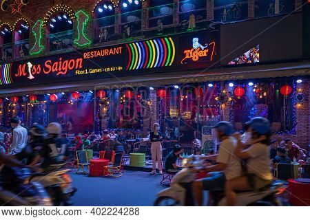 Walking Street Bui Vien During Lockdown. People Are Relaxing On The Open Terrace In The Night Restau