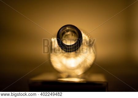 Photo Of Empty Transparent Bottle Of Wine With Light Inside