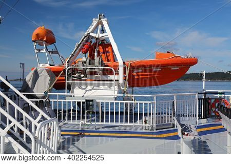 Bjornafjord, Norway - July 23, 2020: Lifeboat On A Car Ferry Crossing Bjornafjord In Norway. Public 