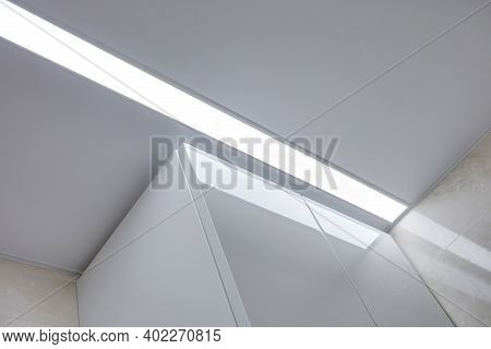 Suspended Ceiling With Halogen Spots Lamps And Drywall Construction In Empty Room In Apartment Or Ho