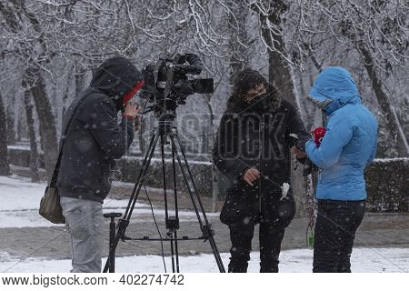 Madrid, Spain - January 07, 2021: A Journalist And A Telemadrid Camera Operator, Working In The Buen