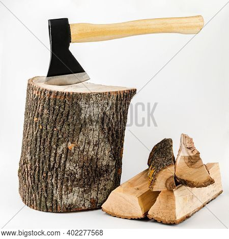 Firewood And An Axe On A White Isolated Background. Renewable Energy Resource. Ecological Concept.