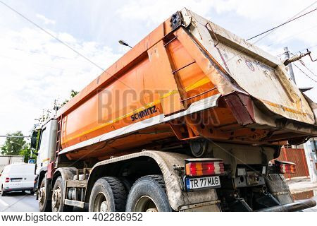 Traffic With Road View Through Car Front Window, Dirty Schmitz Cargobull Tipper Trailer Truck In Tra