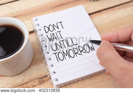 Dont Wait Until Tomorrow, Text Words Typography Written On Book Against Wooden Background, Life And 