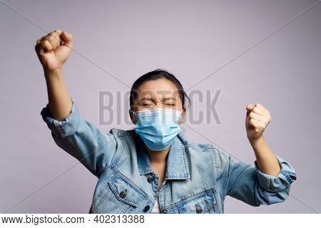 Asian Woman Wearing Protective Face Mask Shouting Isolated Over White Background.