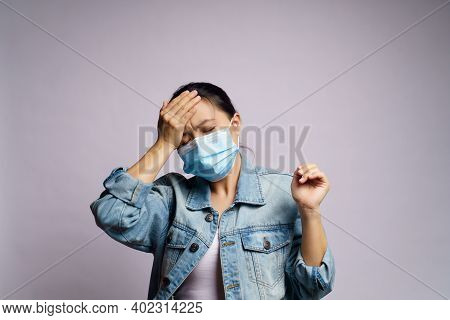 Asian Woman Wearing Protective Face Mask Was Sick With Headache Isolated Over White Background..