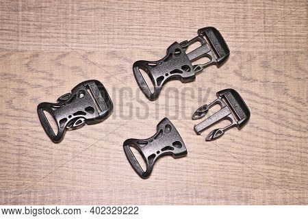 Black Plastic Buckle Fastex For Backpacks. Accessories For Backpacks, Fastener Close-up.