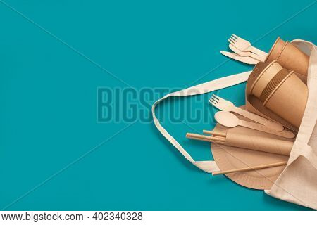 Set Of Eco-friendly Tableware - Kraft Paper Food Cups And Containers In Cotton Bag On Green Backgrou