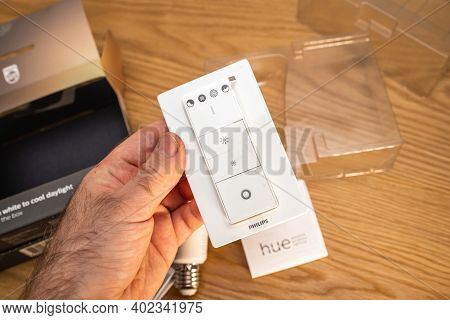 Paris, France - Dec 13, 2020: Pov Male Hand Unboxing Unpacking New Philips Signify Hue Smart Light F
