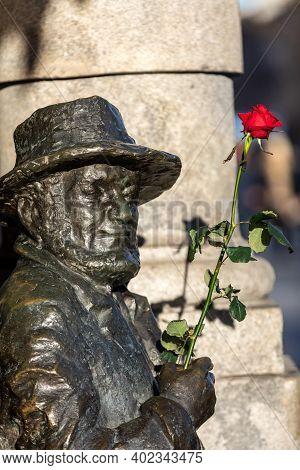 Cracow, Poland - December 10, 2017: Monument To Piotr Skrzynecki From Famous Piwnica Pod Baranami Ca