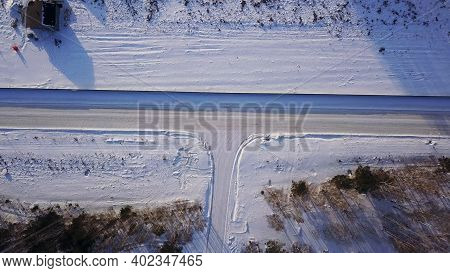 T-shaped Crossroad On A Winter Sunny Day. Action. Aerial Top View Of A Countryside Road Segment Cove