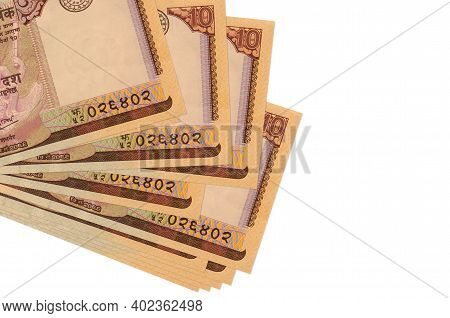 10 Nepalese Rupees Bills Lies In Small Bunch Or Pack Isolated On White. Mockup With Copy Space. Busi