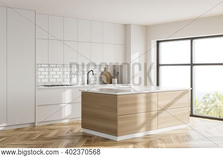 Corner Of Modern Kitchen With White Walls, Wooden Floor, White Cupboards And Wooden Island. 3d Rende