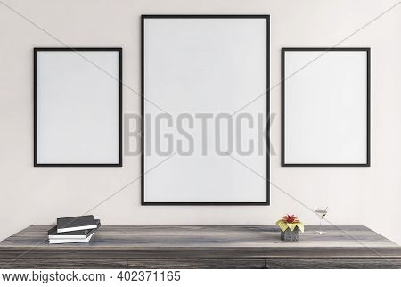 Three Mockup Canvas, Frames On White Wall Above Wooden Deck With Books And Cocktail. Black Frames Fo
