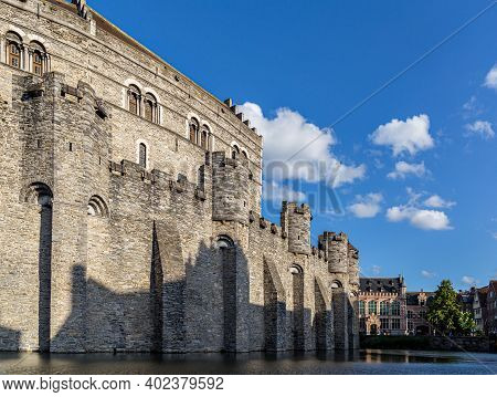 Castle Of Ghent (gand) Mirroring In The Water (belgium)