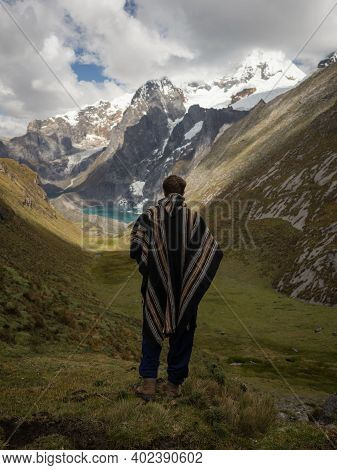 Young Male Hiker In Traditional Poncho At Cordillera Huayhuash Circuit Andes Mountain Gangrajanca La