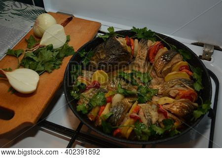 Grilled Salmon Fish With Various Vegetables On Pan On The Flaming Grill