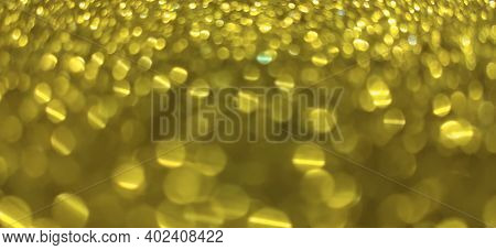 Closeup of Sparkling Golden Bokeh Glitter abstract
