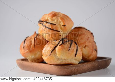 Eclair Drenched In Chocolate Stuffed With White Crème