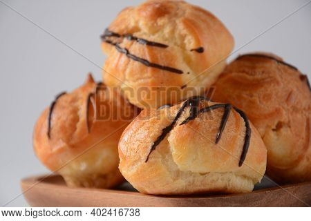 Eclair Drenched In Chocolate Stuffed With White Crème