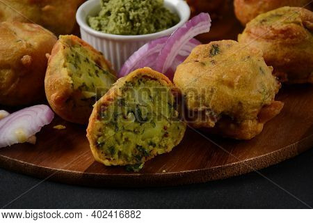 Batata Vada  Popular Street Food Of India, Served With  Green Chutney.