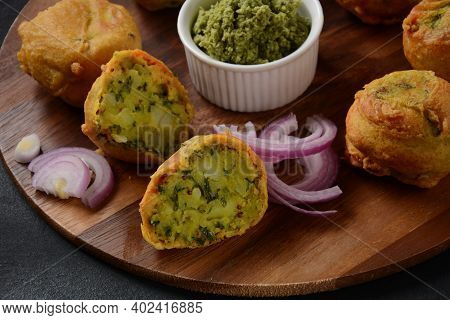 Batata Vada  Popular Street Food Of India, Served With  Green Chutney.