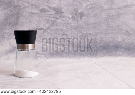 Glass Salt Shaker Close Up On Gray Background, Copy Soace