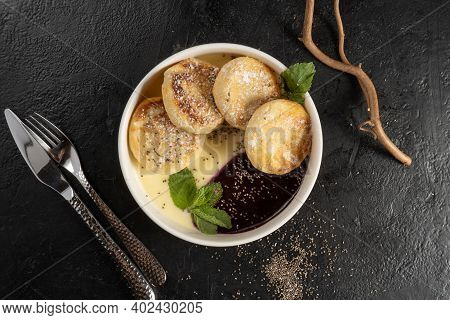 Сottage Cheese Pancakes With Berry Sauce, Mint And Chia Seeds. Classic Hot Breakfast. Syrniki - Frit