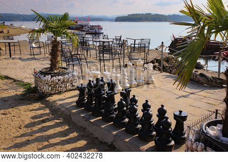 Solina, Poland - September 05, 2018: Huge Chess Pieces On The Beach. Entertainment For Tourists.