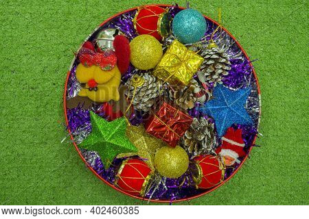 Christmas Gift Decorated With Green Branch, Pine Cone, Gift Bag Red And Silver Beads Garlans On Knit