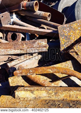 Heap Of The Scrap Iron. Pile Of Secondary Raw Materials. Iron Raw Materials Ready For Recycling. Col