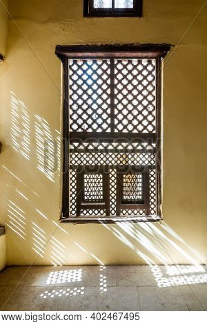 Single Interleaved Grunge Wooden Ornate Windows - Mashrabiya - In Stone Wall At Abandoned Building