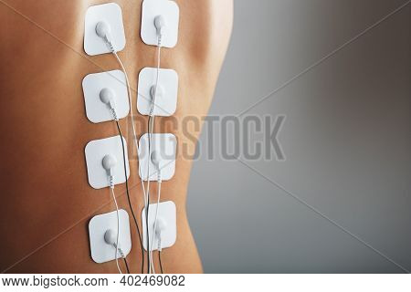 Electrode Stimulating Massage Of The Spine At Home.