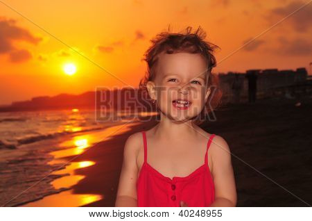 Tousled little girl in red dress