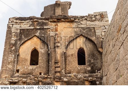 Hampi, Karnataka, India - November 5, 2013: Zanana Enclosure. Closeup Of Brown Stone Ruinous Damaged