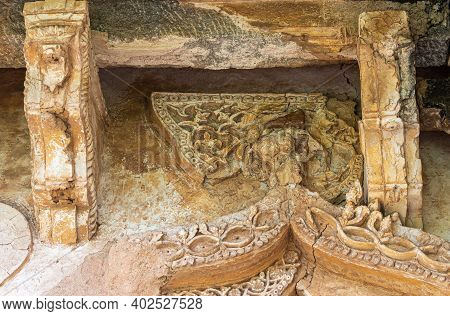 Hampi, Karnataka, India - November 5, 2013: Zanana Enclosure. Closeup Of Damaged Decorated Brown Sto
