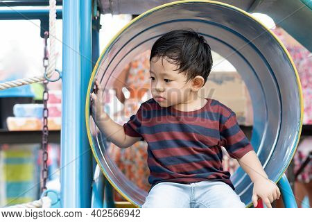 Asian Boy Portrait Tired Expression, Little Boy Playing At The Park On The Playground For Kids & Chi