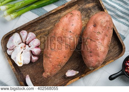 Sweet Potato Or Batat With Spices On White Background, Top View.