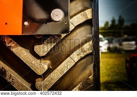 Black Tyre Of Vehicle Or Agricultural And Industrial Machine, Close Up