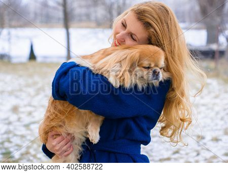 Nice Young Woman On A Walk With Her Dog Resting At Park. Best Friendship Girl And Senior Dog. Psycho