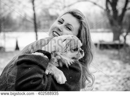 Nice Young Woman On A Walk With Her Dog Resting At Park. Best Friendship Girl And Senior Dog. Psycho