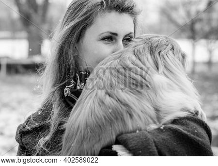 Nice Young Woman On A Walk With Her Dog Resting At Park. Best Friendship Girl And Senior Dog. Psycho