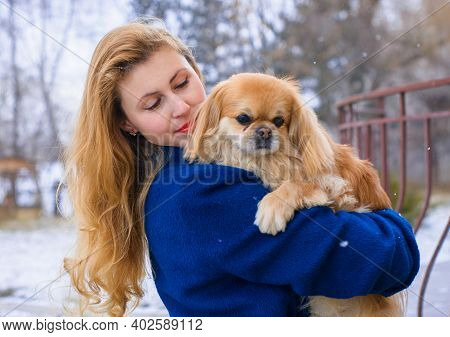 Nice Young Woman On A Walk With Her Dog Resting At Park. Best Friendship Girl And Senior Dog. Psycho